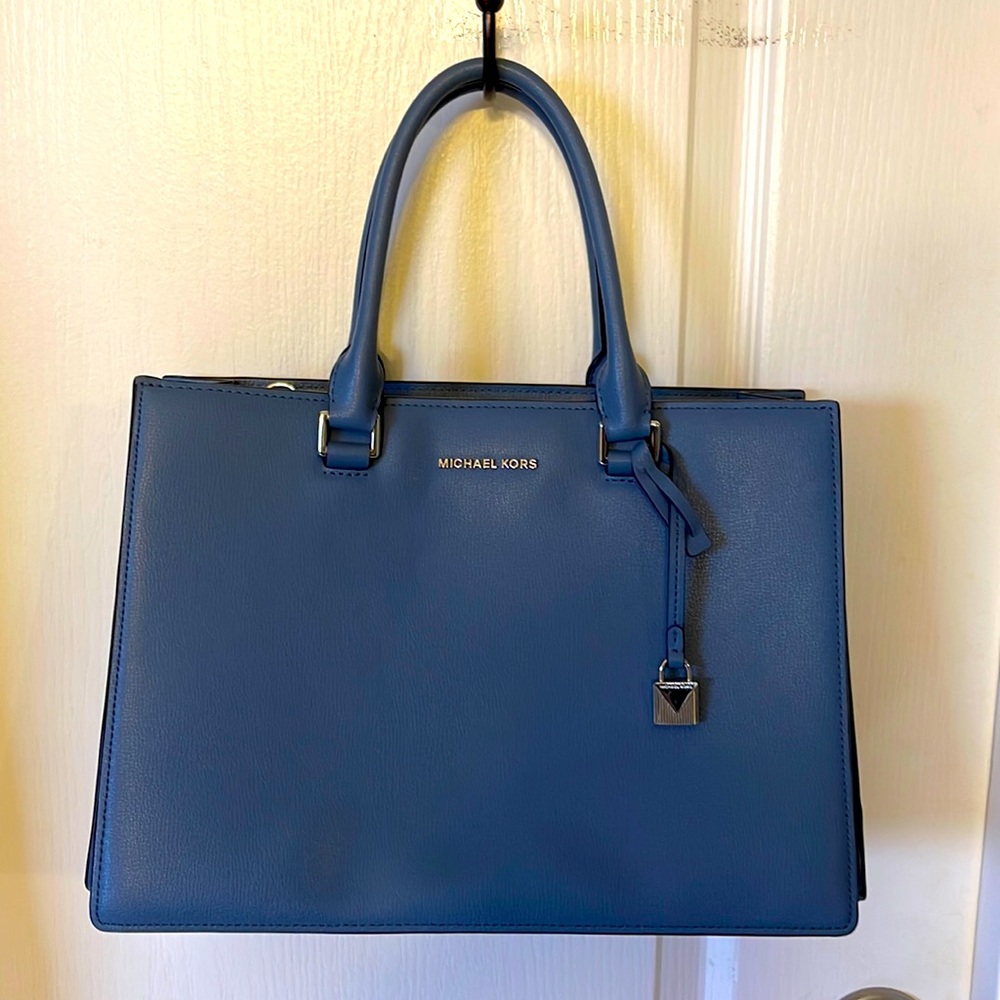 Great condition Michael Kors blue purse with key tag inside.